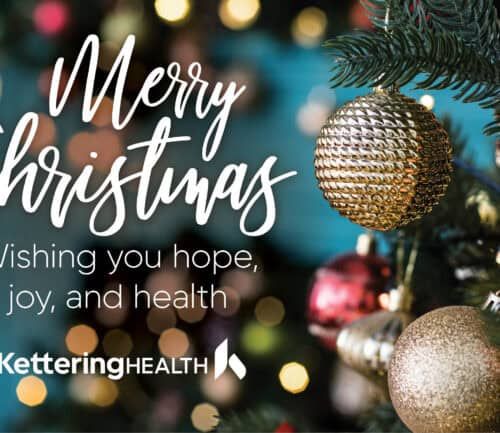 Merry Christmas greeting from Kettering Health with decorated Christmas tree and ornaments
