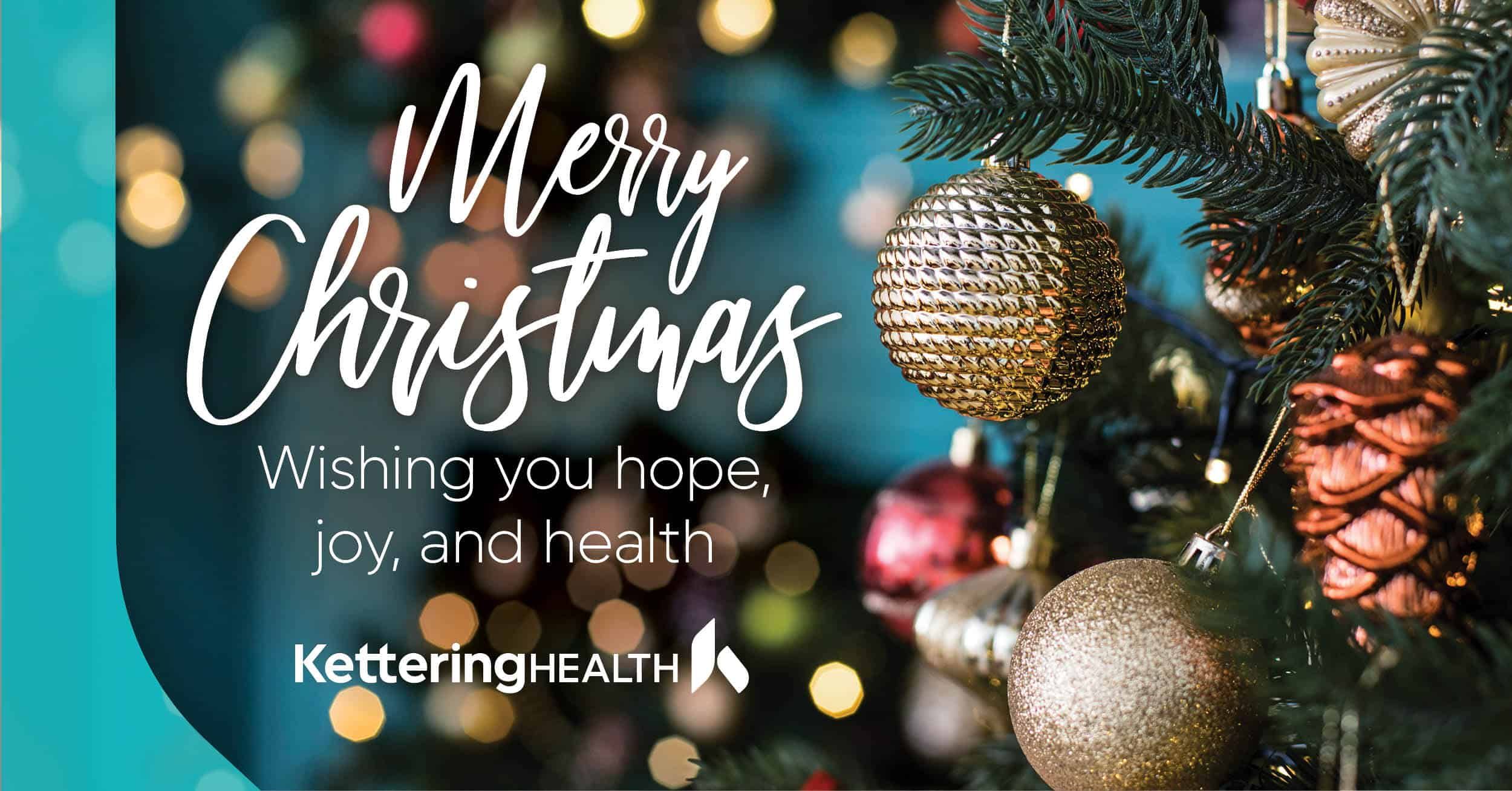 Merry Christmas greeting from Kettering Health with decorated Christmas tree and ornaments
