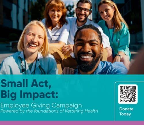 Five diverse healthcare workers in scrubs smiling together outdoors for employee giving campaign