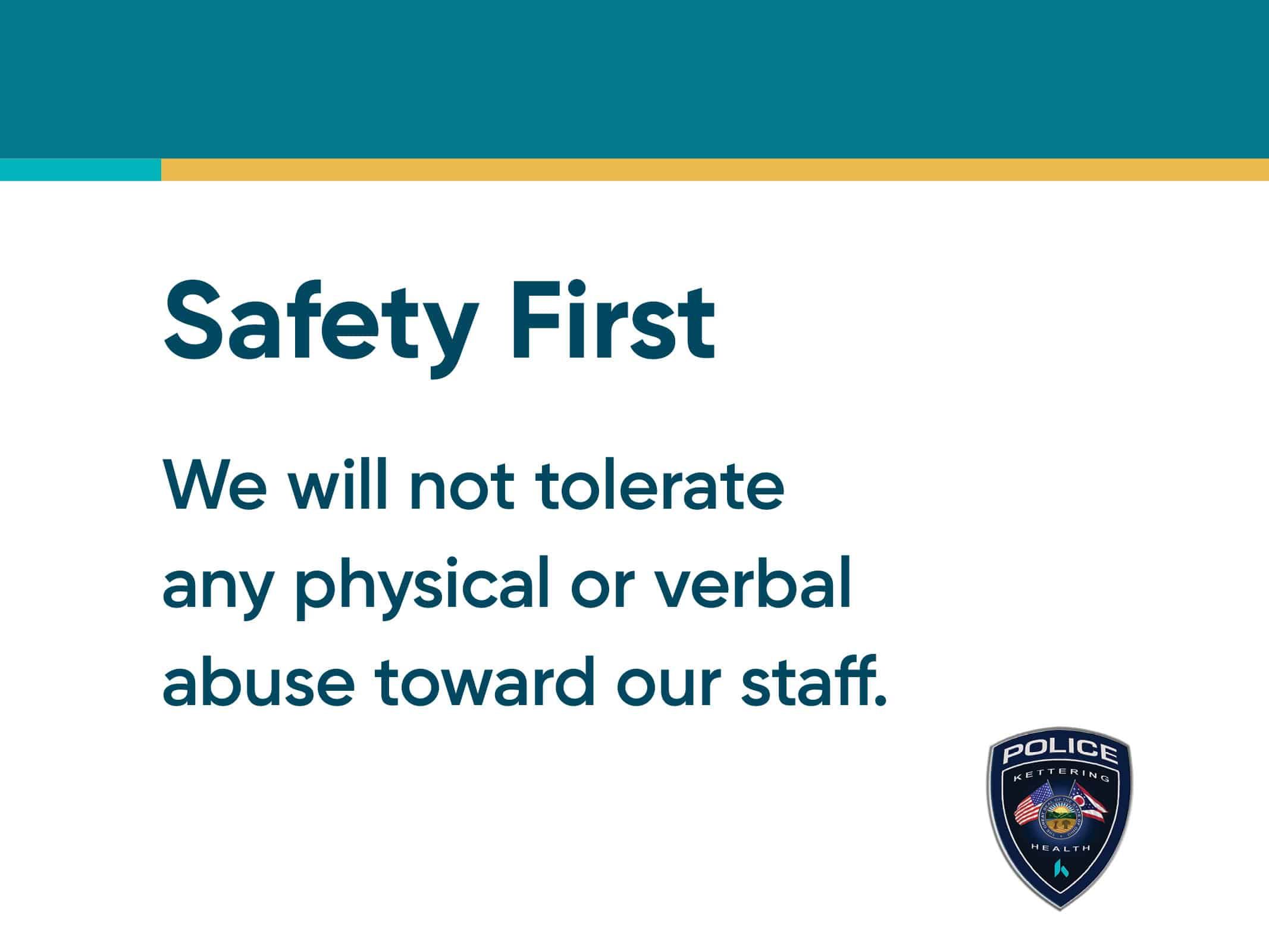 Safety First workplace policy sign stating no tolerance for staff abuse with police badge