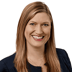 Professional headshot of Amber Rose Brown smiling in dark business attire