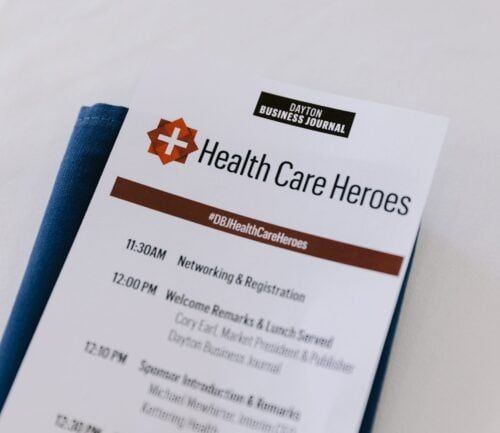 Program schedule for Dayton Business Journal Health Care Heroes event with networking times