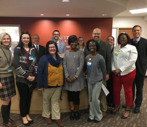 Group of healthcare professionals posing together at Kettering Health facility celebration event