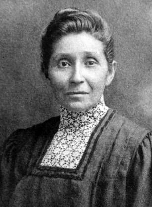 Historical black and white portrait of Dr. Susan La Flesche Picotte in formal dress