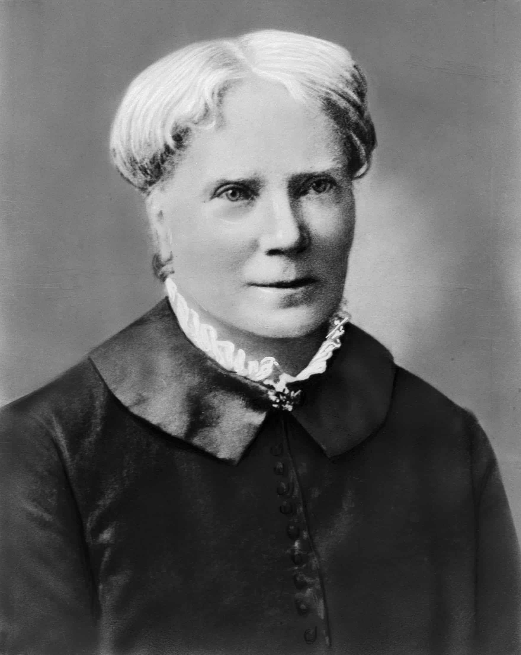 Historical black and white portrait of Elizabeth Blackwell in Victorian-era dress with white collar.
