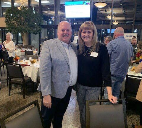 Two professionals posing together at a Kettering Health networking event in restaurant setting
