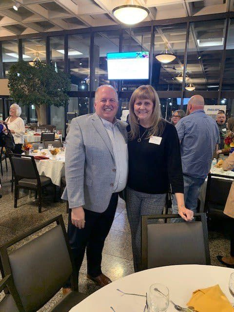 Two professionals posing together at a Kettering Health networking event in restaurant setting