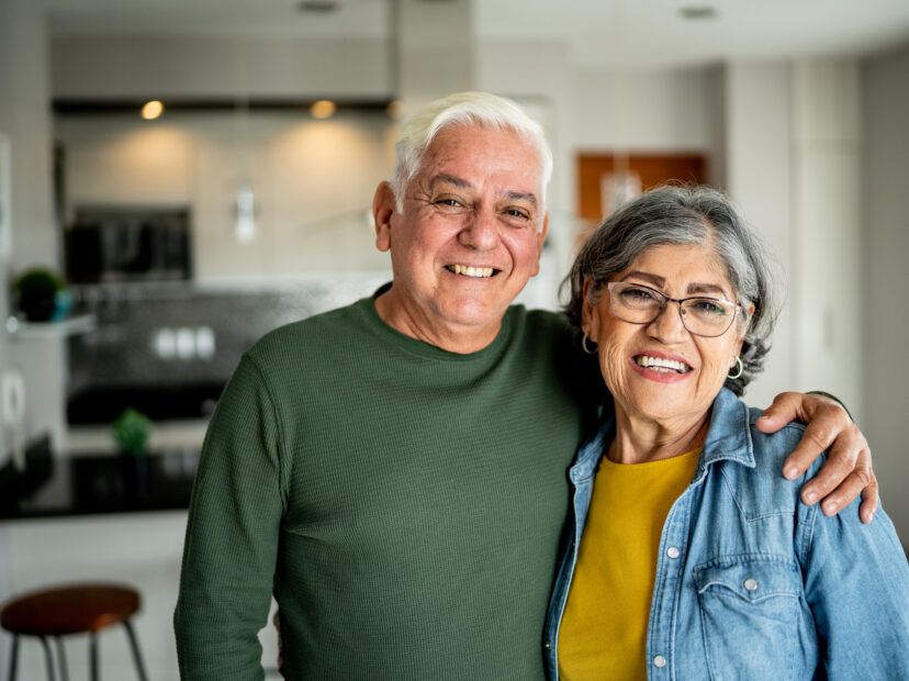 Portrait of a senior couple embracing at home
