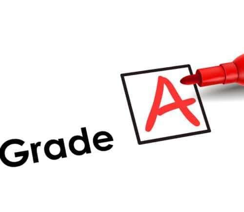 Red marker writing letter A in black-outlined box next to word "Grade"