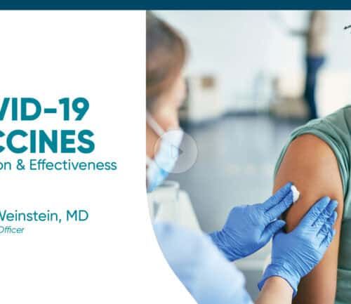 Healthcare worker administering COVID-19 vaccine to masked patient in medical setting