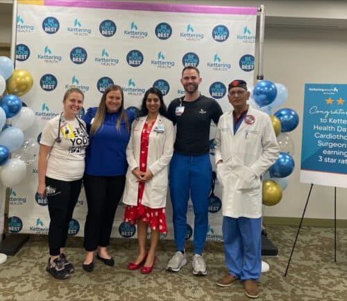 Five Kettering Health staff members celebrating cardiothoracic surgeons' three-star rating achievement