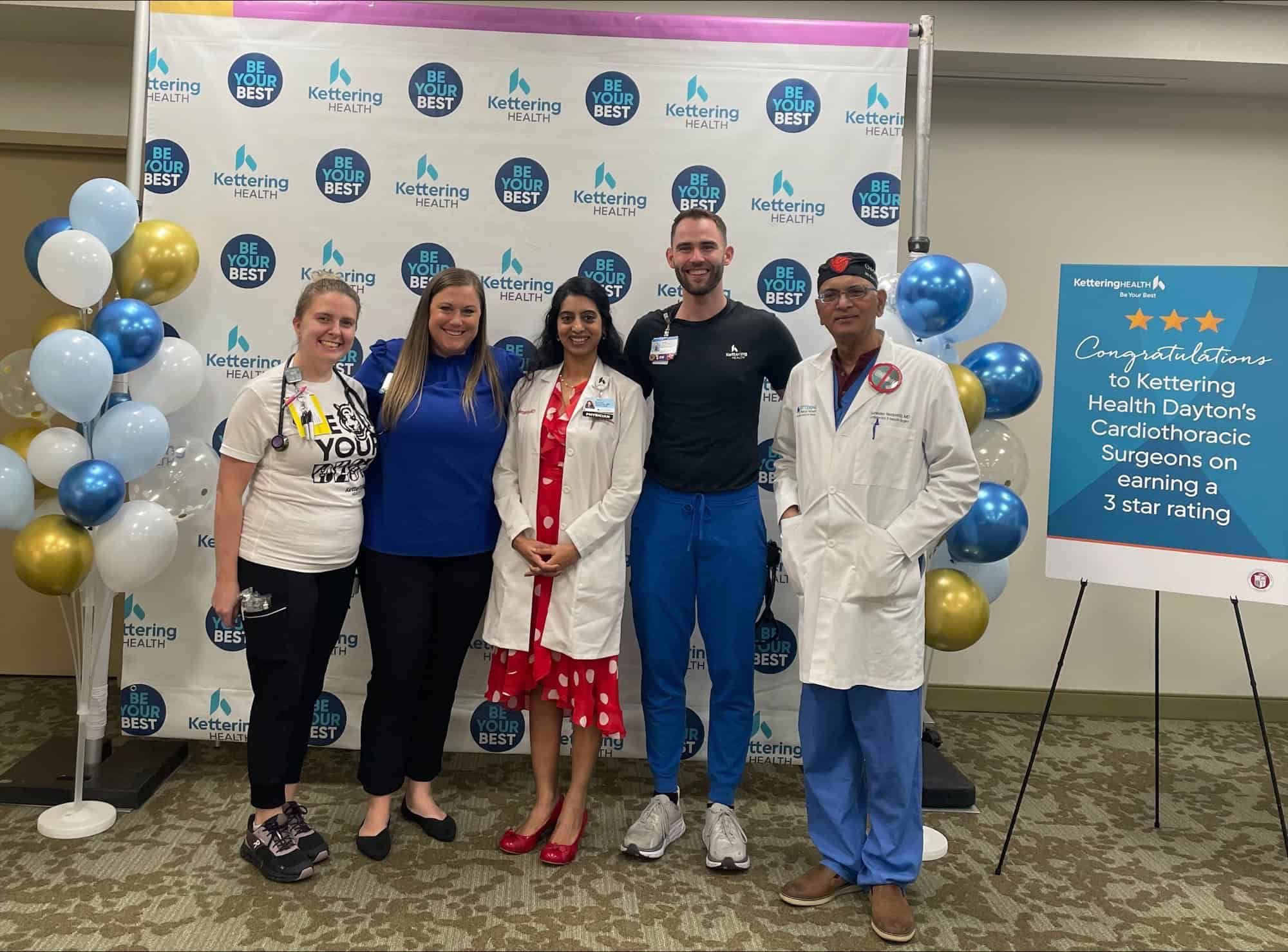 Five Kettering Health staff members celebrating cardiothoracic surgeons' three-star rating achievement