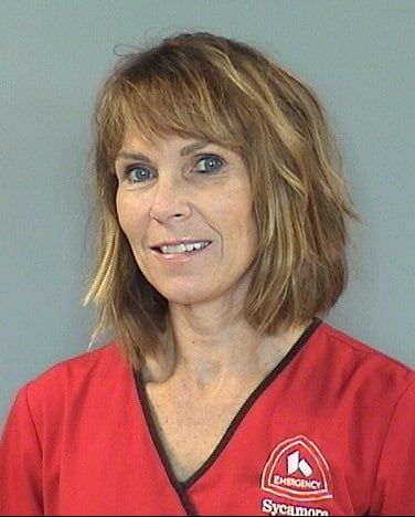 Professional headshot of healthcare provider in red Kettering Health scrubs