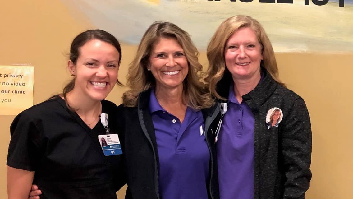 Three healthcare professionals posing together at Kettering Health medical facility