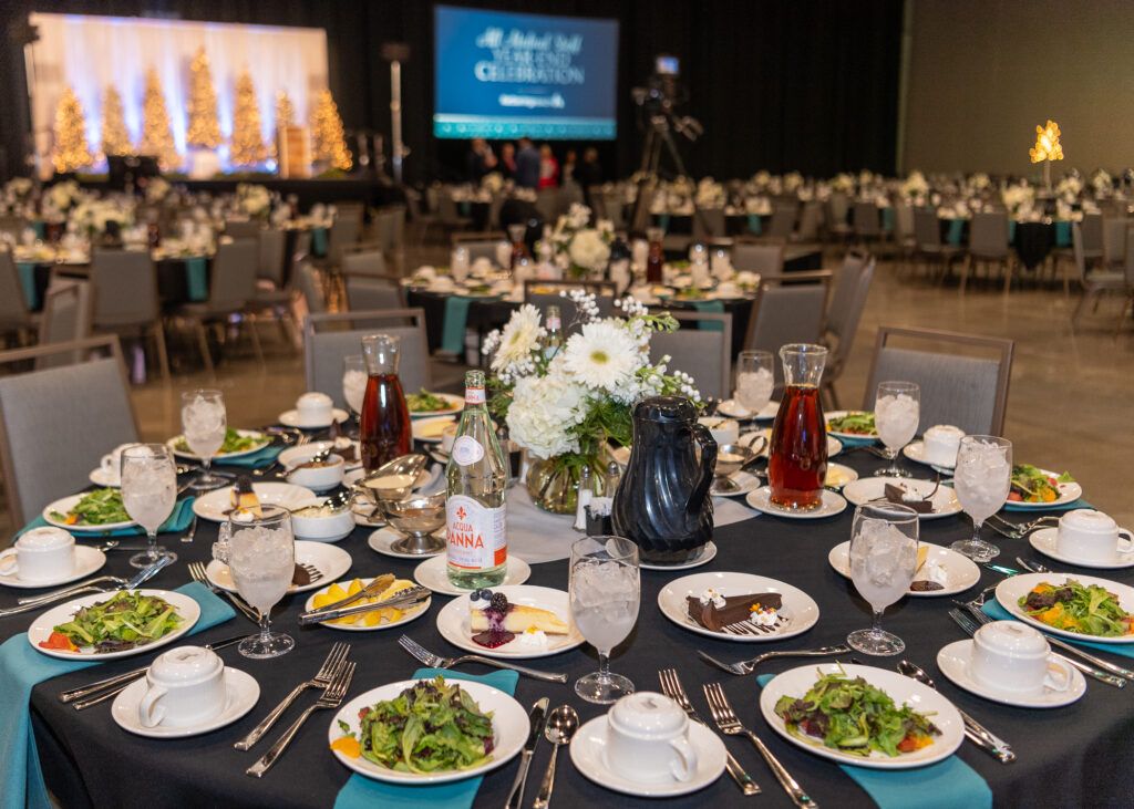 A circular table set with food and decorations