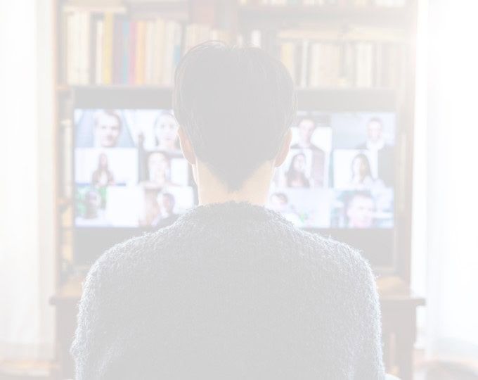 Two people browsing books together in a library or bookstore