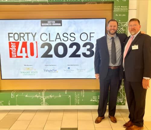 Two businessmen pose together at Dayton Business Journal Forty Under 40 Class of 2023 event