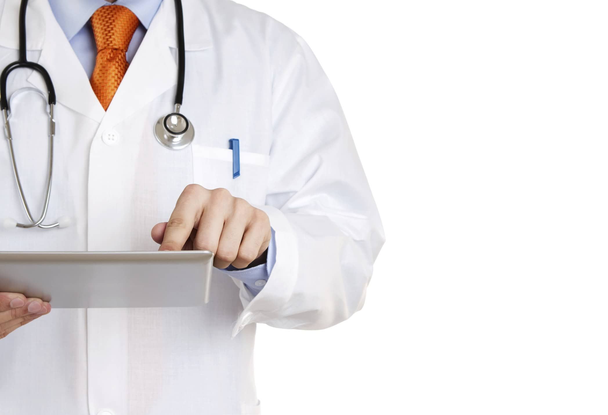 Doctor in white coat with stethoscope using tablet computer