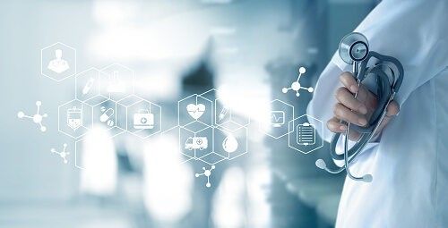 Doctor holding stethoscope with digital healthcare icons and medical symbols overlay