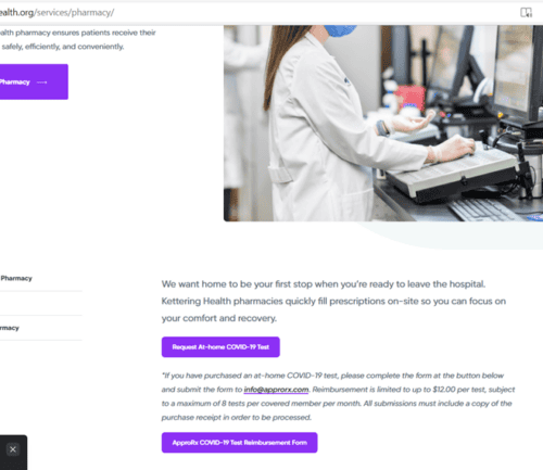 Pharmacist in white coat working at computer station in hospital pharmacy