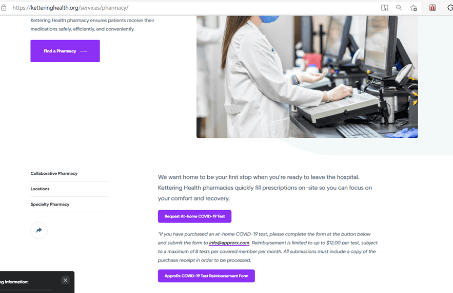 Pharmacist in white coat working at computer station in hospital pharmacy