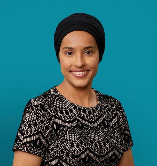 Professional headshot of Dr. Gurpreet K. Bahga wearing black headwrap and patterned top