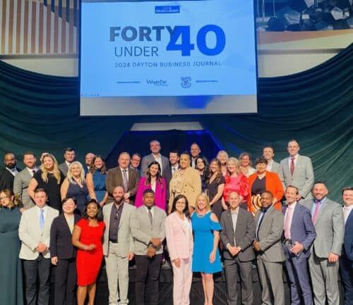 Group of business professionals posing at Forty Under 40 awards ceremony event