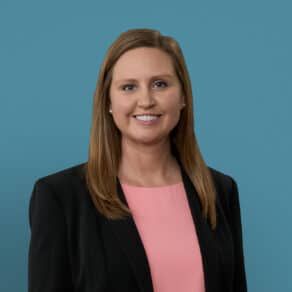 Professional headshot of Dr. Taylor C. Kabacinski in black blazer and pink top