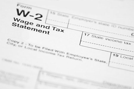 Close-up of W-2 tax form showing wage and tax statement fields