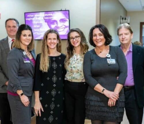 Healthcare professionals and staff posing together at Kettering Health women's health event
