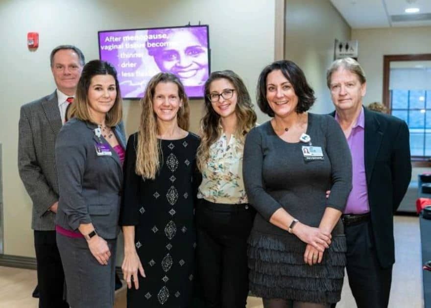 Healthcare professionals and staff posing together at Kettering Health women's health event