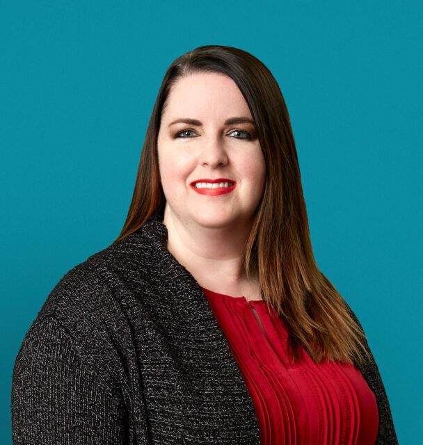 Professional headshot of Yvonne V. Kuhn, PA-C wearing red blouse and gray blazer