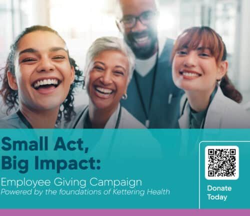 Four diverse healthcare workers in scrubs laughing together with Employee Giving Campaign text