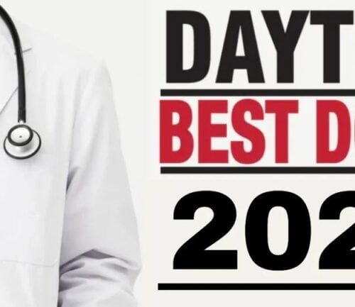 Doctor in white coat with stethoscope next to "Dayton Best Docs 2025" text