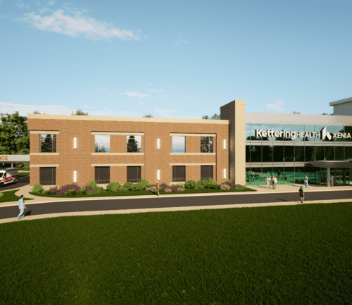 Architectural rendering of Kettering Health Xenia medical facility with ambulance bay and landscaping
