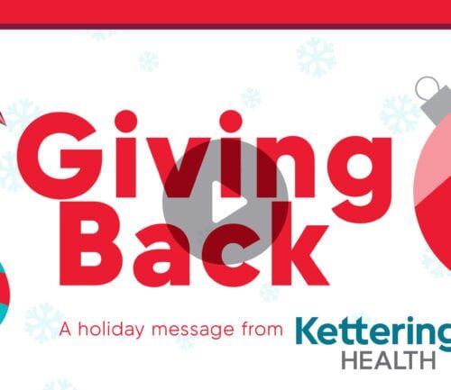 Colorful holiday-themed graphic with "Giving Back" text and Christmas ornaments from Kettering Health