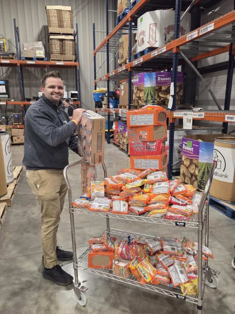 Sports Medicine staff sorting food at The Foodbank