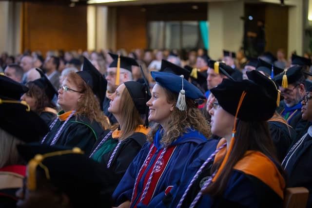 Audience members watching the ceremony