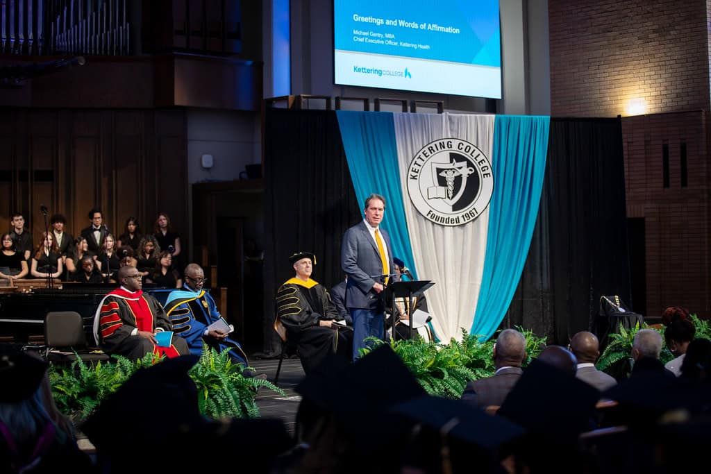 Mike Gentry speaking at a podium