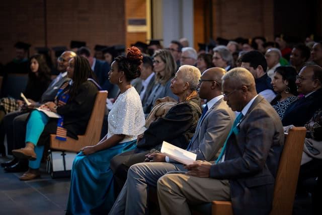 Audience members watching the ceremony