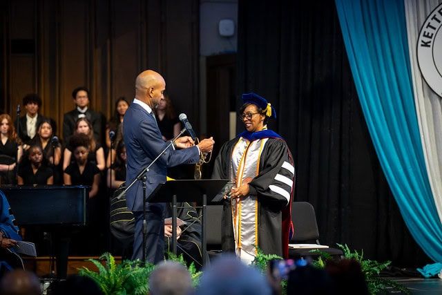 Dr. Mitchell receiving the Chain of Office