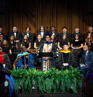 Dr. Mitchell speaking at a podium