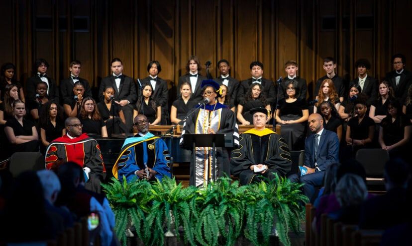 Dr. Mitchell speaking at a podium