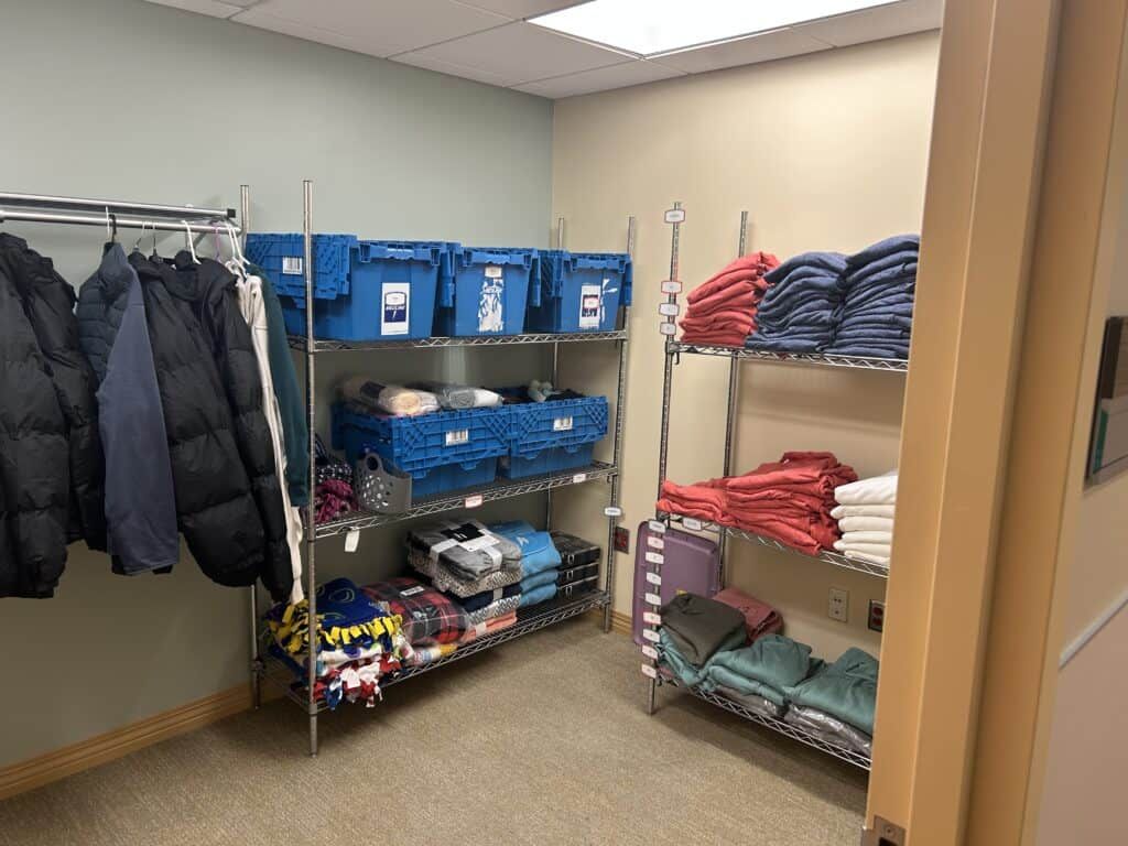 Clothes on racks inside the closet