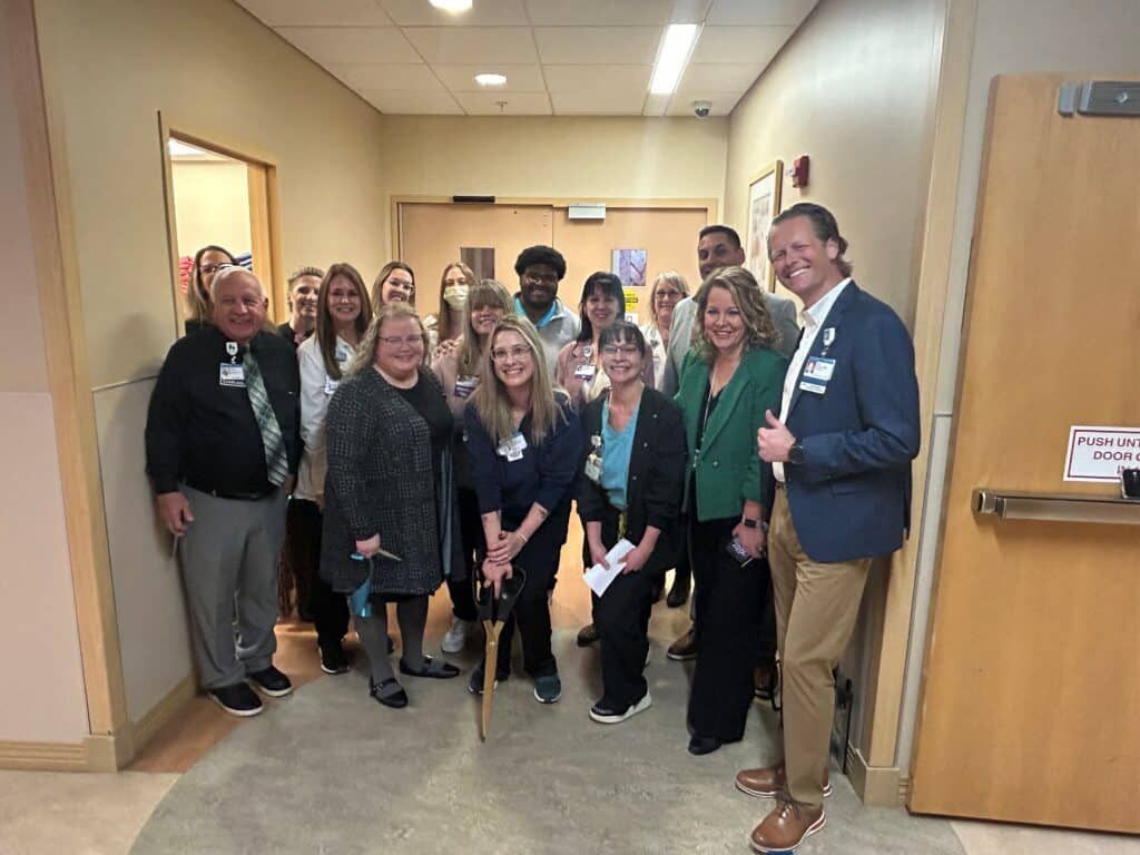 Soin Medical Center team standing outside the closet and smiling