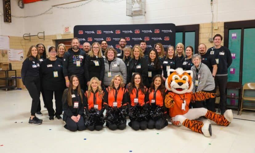 Volunteers standing and smiling