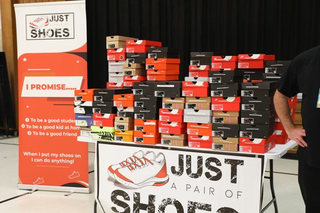 Shoeboxes stacked on table