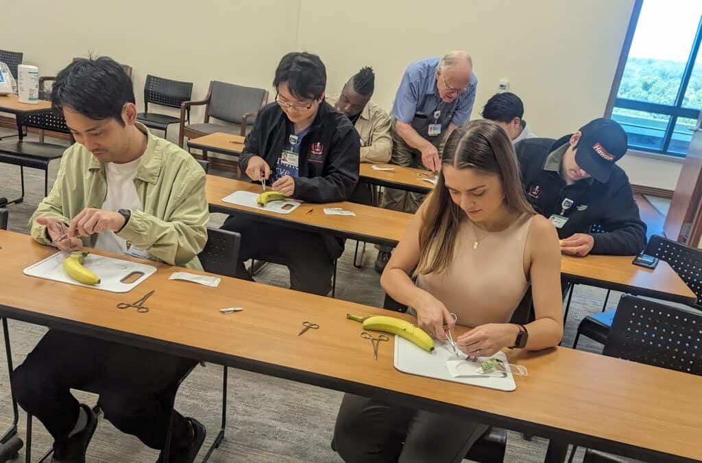 Students working in a suture workshop