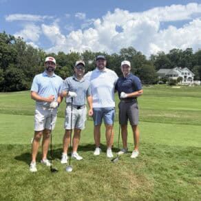 Eagle seekers foursome group photo on the golf course