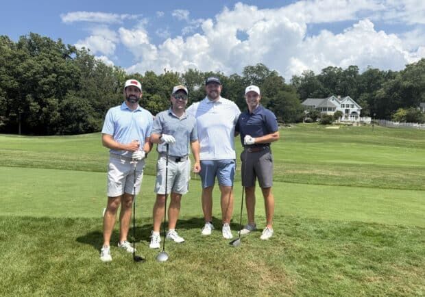 Eagle seekers foursome group photo on the golf course